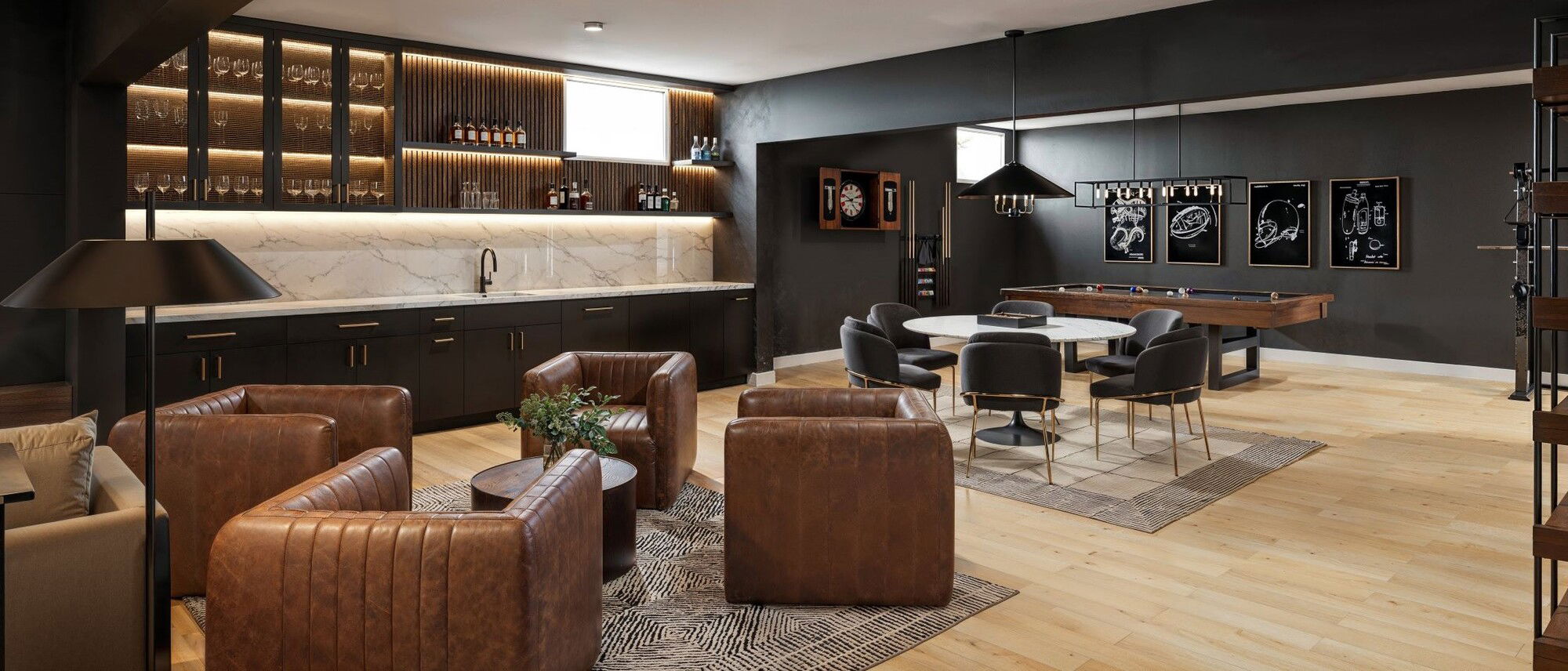 Modern Masculine Open Concept Basement by interior designers in Alexandria, Virginia