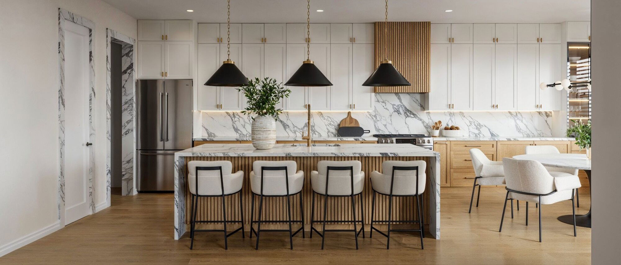 Modern Minimalist Kitchen with Marble Accents by top Orlando interior designers