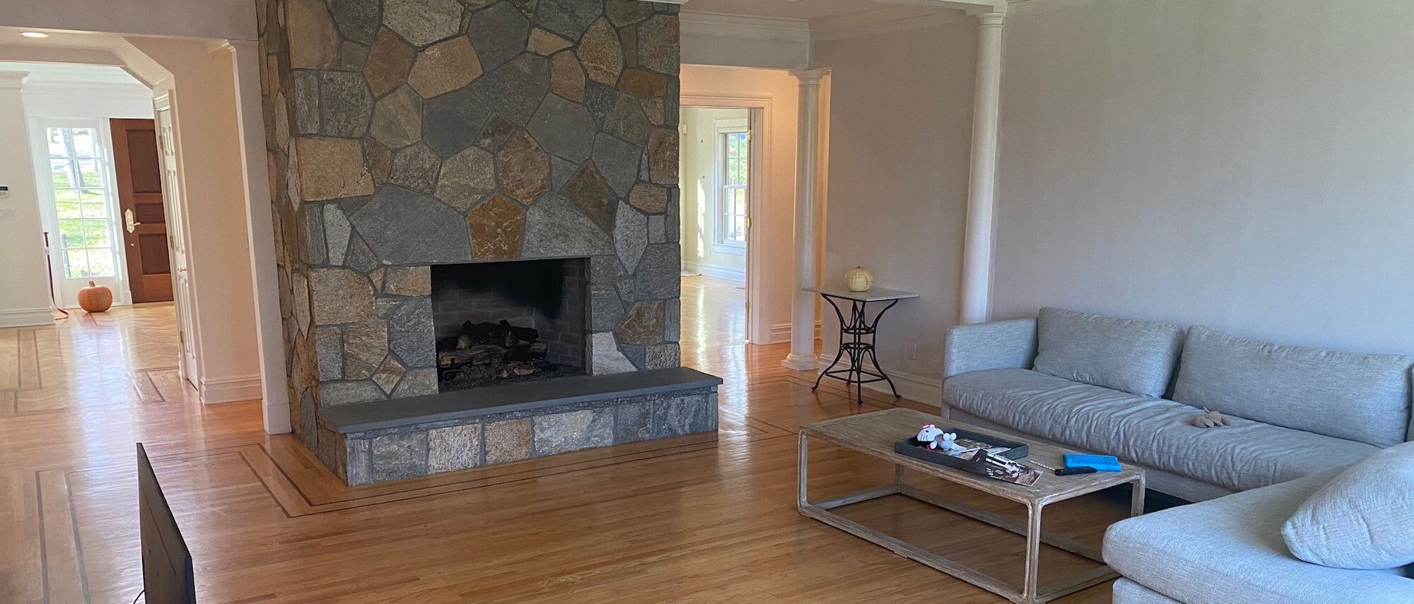 Contemporary Home Design with Stone Fireplace- Before Photo