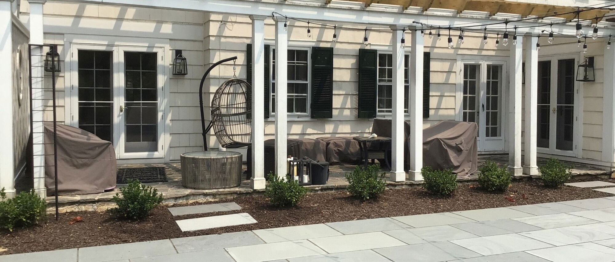 Bluestone Patio with Fireplace & Covered Porch- Before Photo