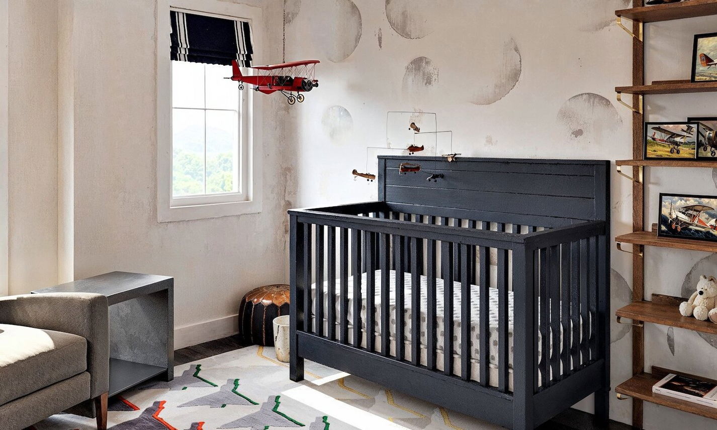 Rocket & Airplane Themed Nursery Design by affordable Aurora interior designers