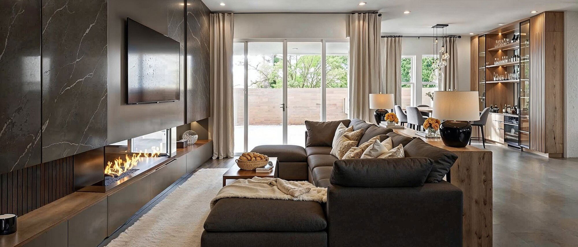 Modern Living and Dining Room with a Bar by affordable Las Vegas interior designers