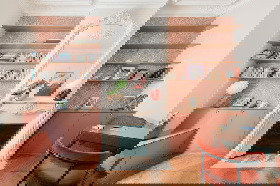 Pink home decor and furniture in a living room by Decorilla designer, Sandra B.