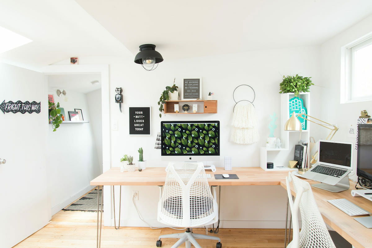 Modern-home-office-with-light-wood-and-plants-as-part-of-creative-employee-incentives-Breanna