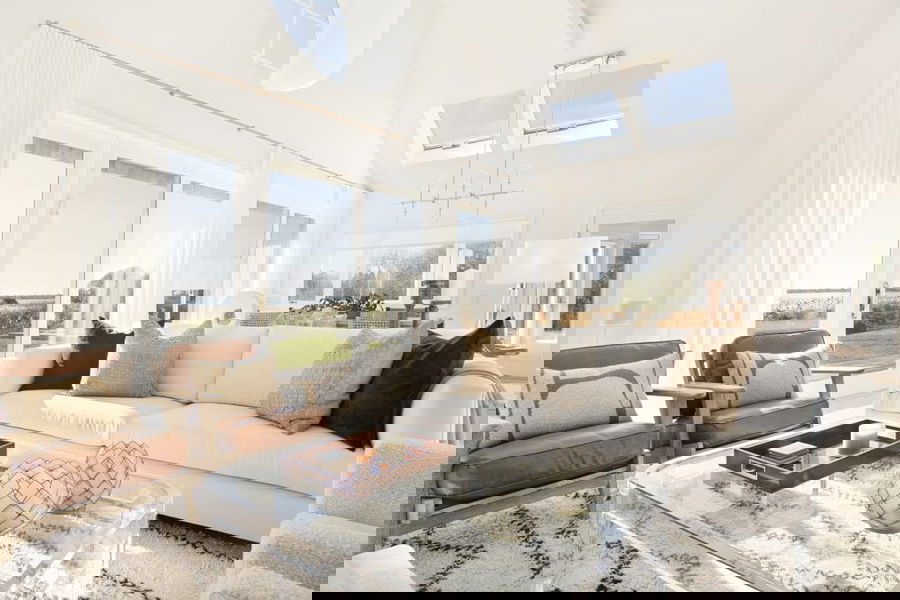 Winter decor ideas in a lakeside living room by interior by Decorilla designer, Peter C.