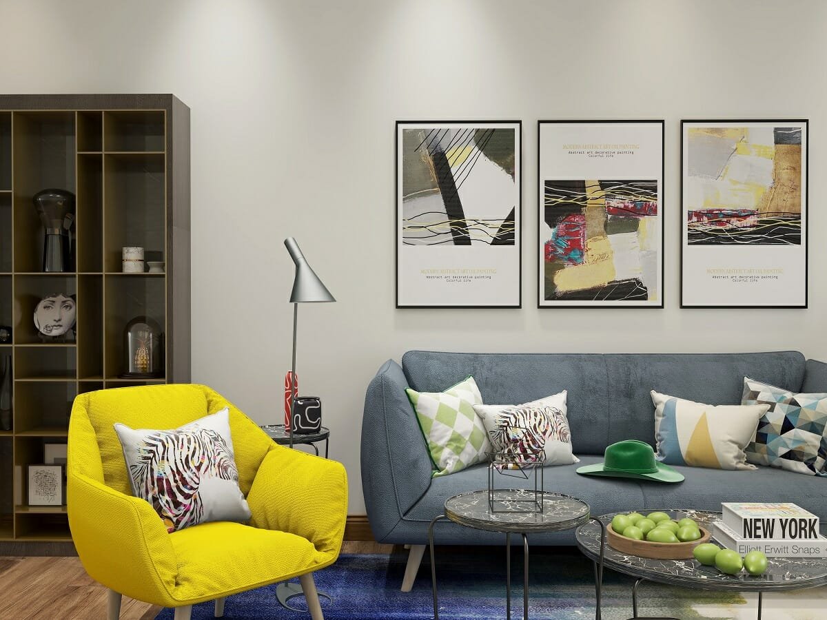 Contemporary modern lounge with a yellow occasional chair and geometric print scatters by online interior designer Kassondra Leigh