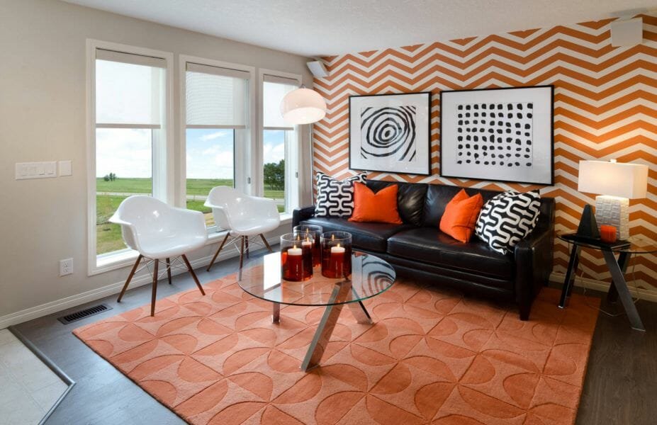 Geometric orange accent wall in living room design