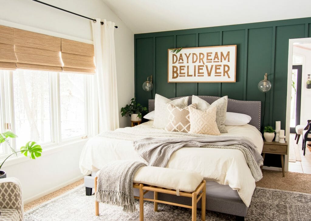 Sage green accent wall in bedroom design