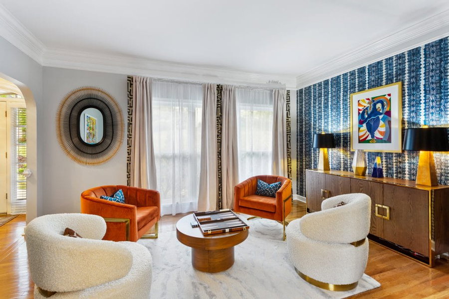 Eclectic living room with a bold accent wall, by Decorilla designer, Sierra W.