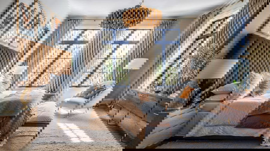 Transitional glam primary bedroom design by Decorilla