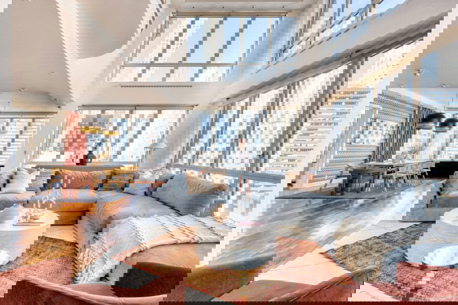 Custom curated open-plan living room interior design by Decorilla designer, Megan W.