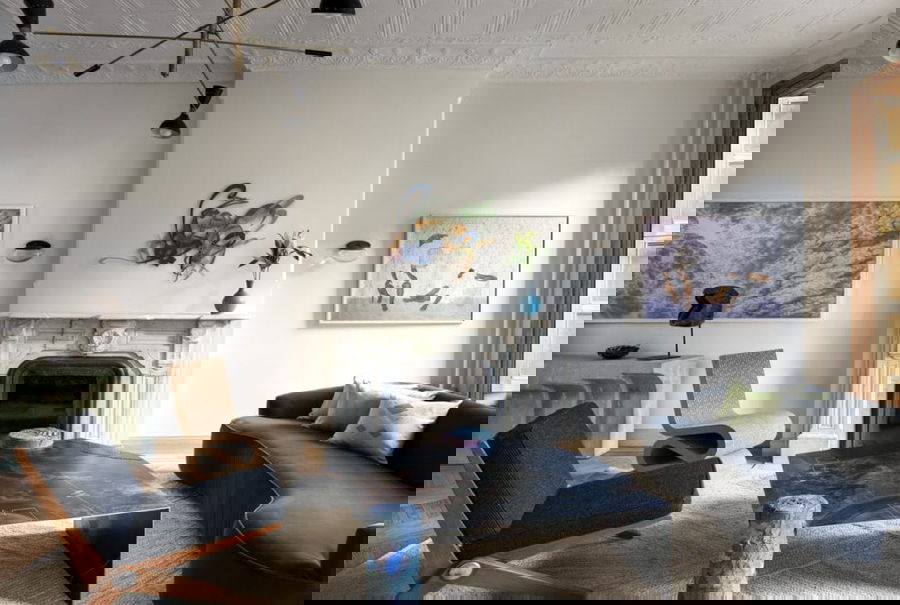 Eclectic nostalgia decor in a living room by Decorilla designer, Catherine W. 