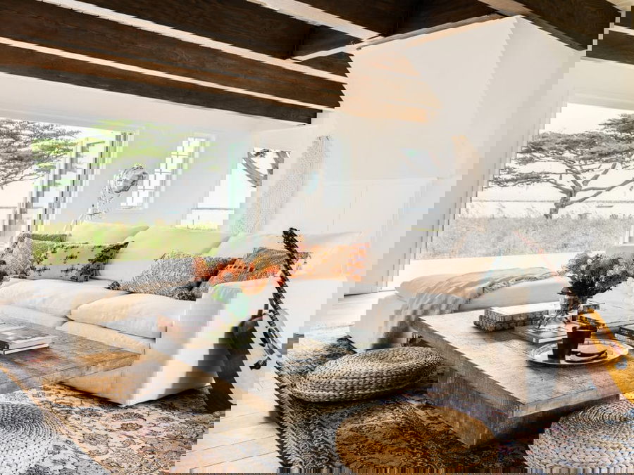 Cozymaxxing trend in a boho living room by Decorilla designer, Brittney A. 