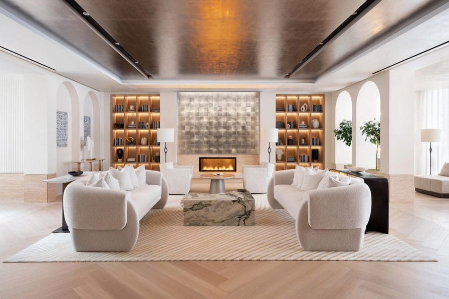 Curved furniture in a luxury glam transitional living room by Decorilla designer, Molly I