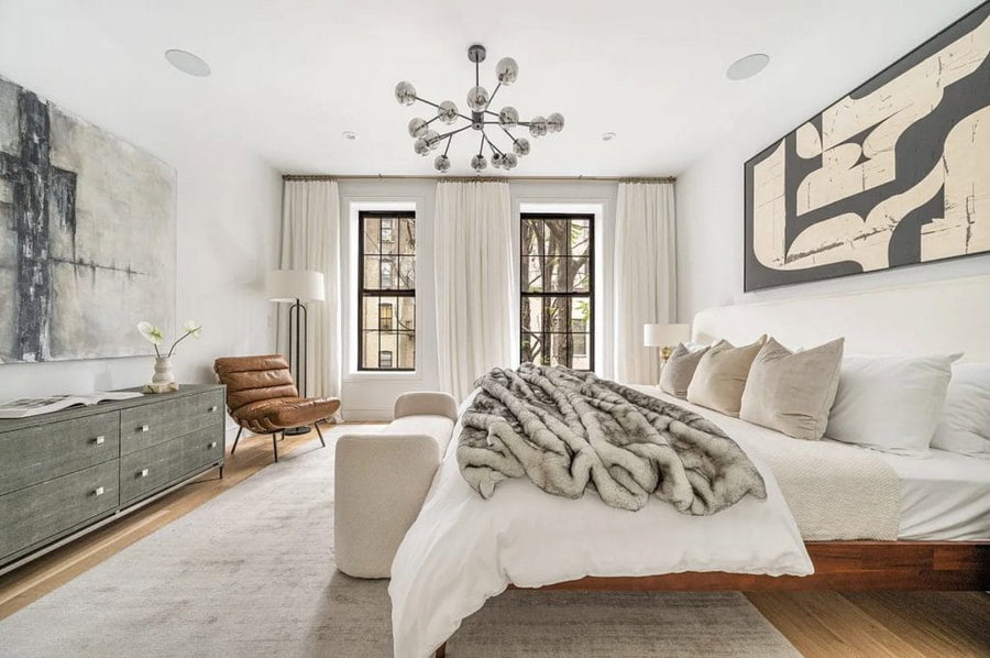 Elegant primary suite design by Decorilla